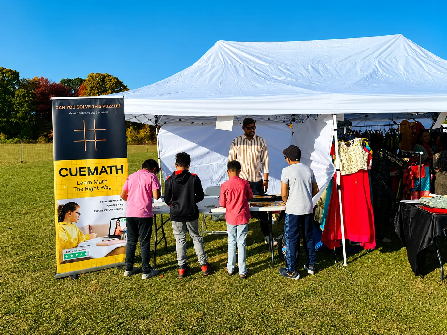 Children at an outdoor MathFit Challenge booth
